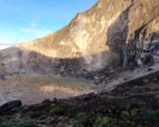 A italian couple tourist hiking to the mount sibayak volcano