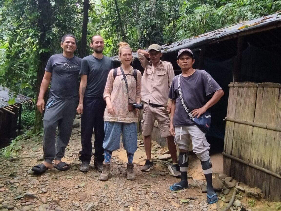 Posing in front of the jungle shelter