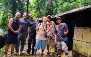 Posing in front of the jungle shelter in the sumatra jungle bukit lawang