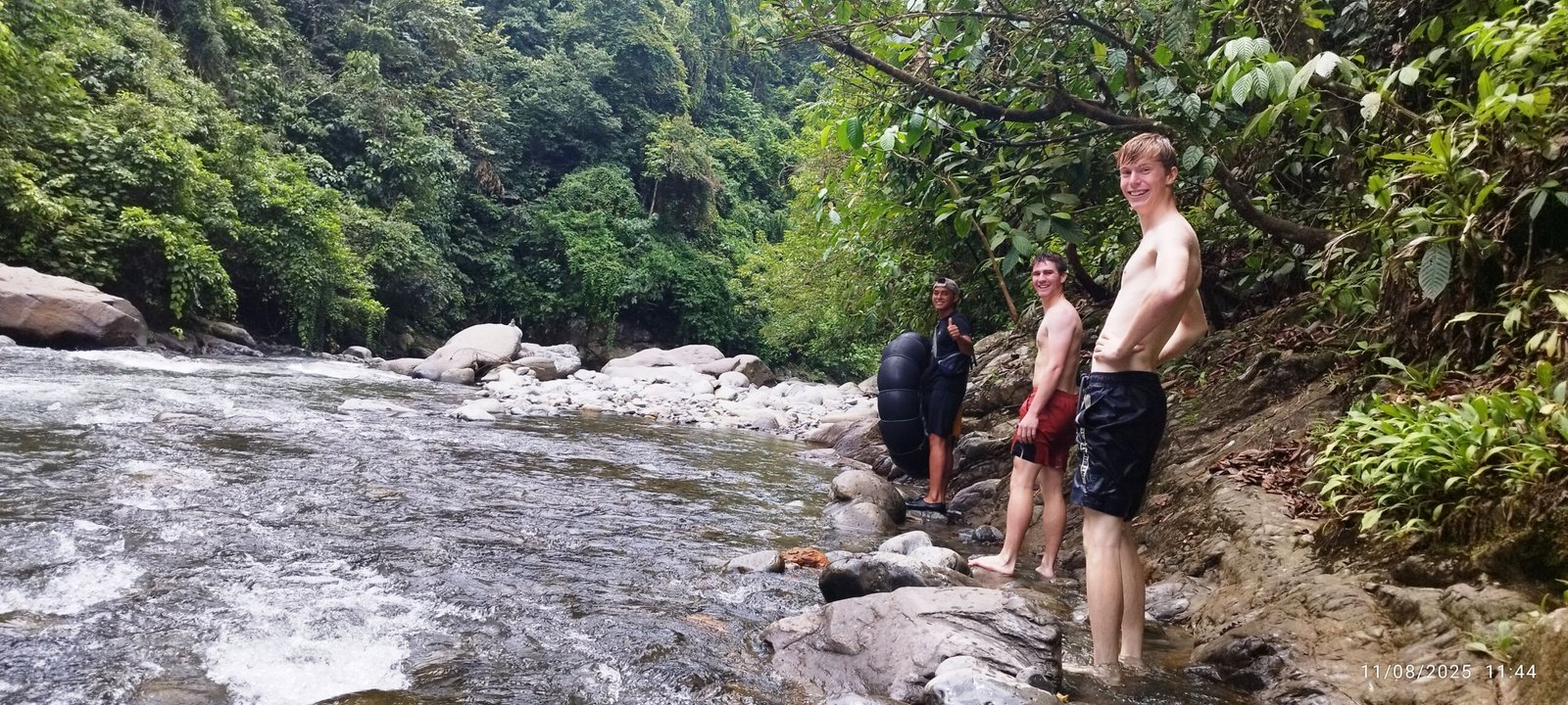 Walking on the river bank sumatra tropical jungle bukit lawang