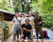 Posing at the front of the jungle shelter