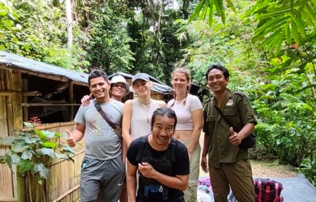 Posing at the front of the jungle shelter