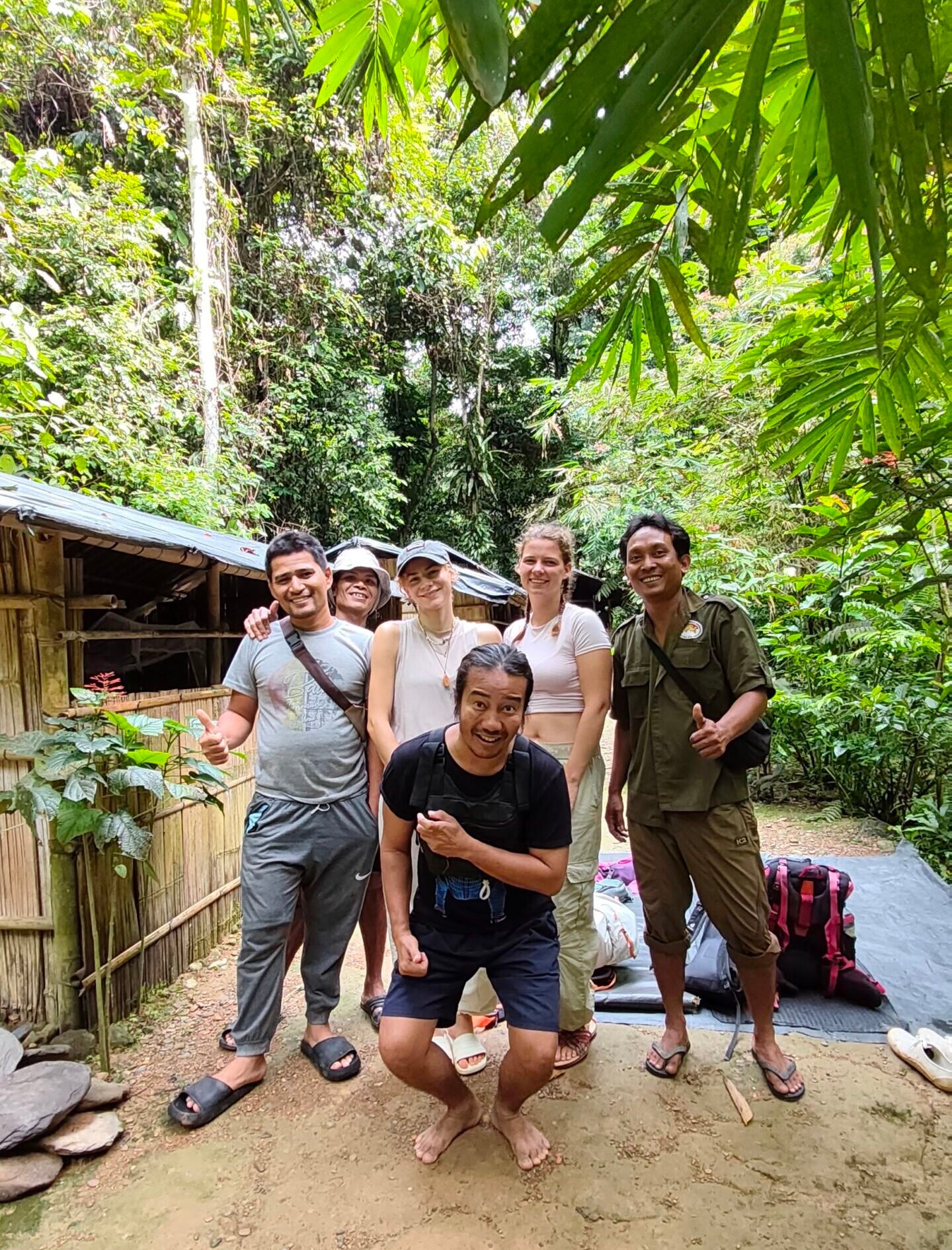 Posing at the front of the jungle shelter
