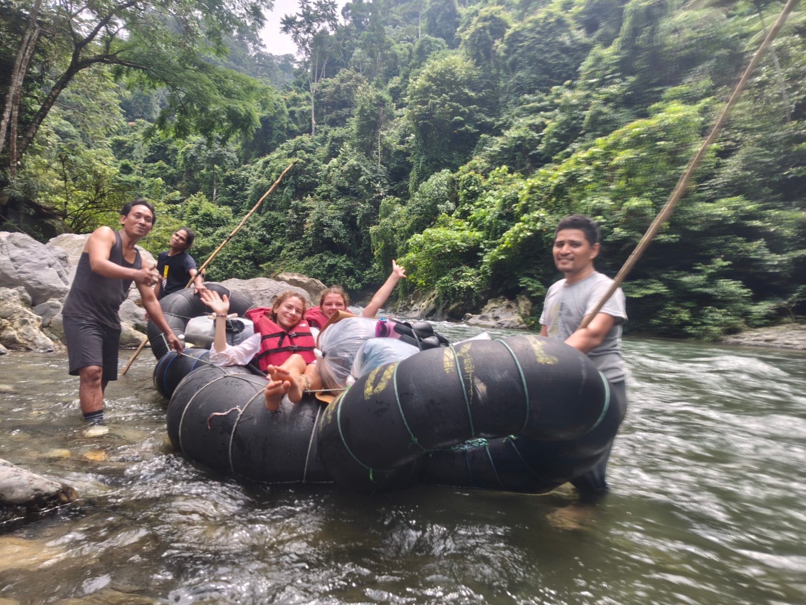 Tube rafting returning from the jungle trek tour in bukit lawang